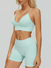 EnovStars women's seamless sports bra and shorts set in light aqua, front view