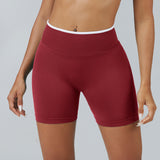 Personalized seamless athletic shorts with custom branding in cherry red