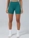 Personalized seamless athletic shorts with custom branding in teal