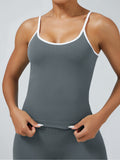 Graphite grey seamless cami with removable chest pads and white contrast trim, sleek athletic top for fitness activities