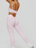 EnovStars women's seamless sports bra and leggings set in light pink, back view