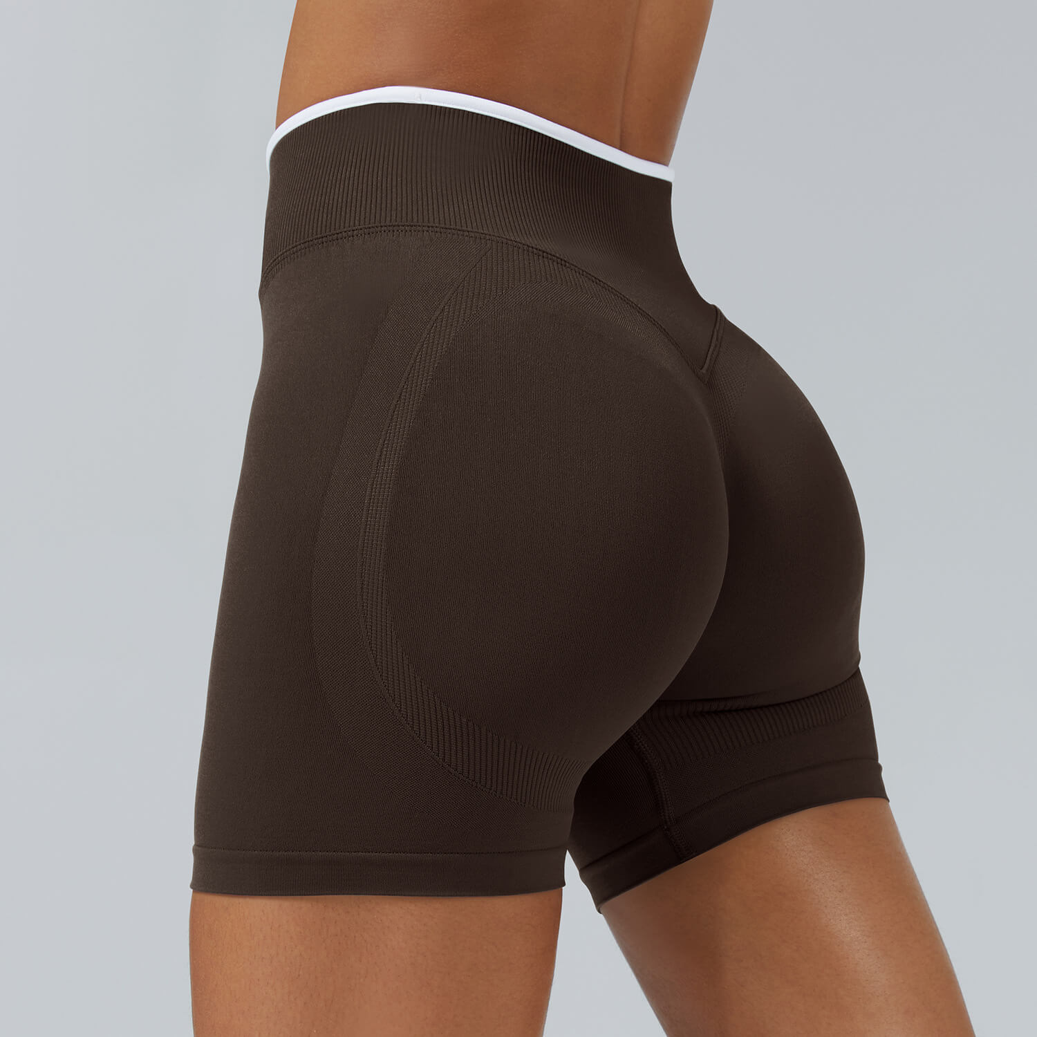 Personalized seamless athletic shorts with custom branding in coffee brown