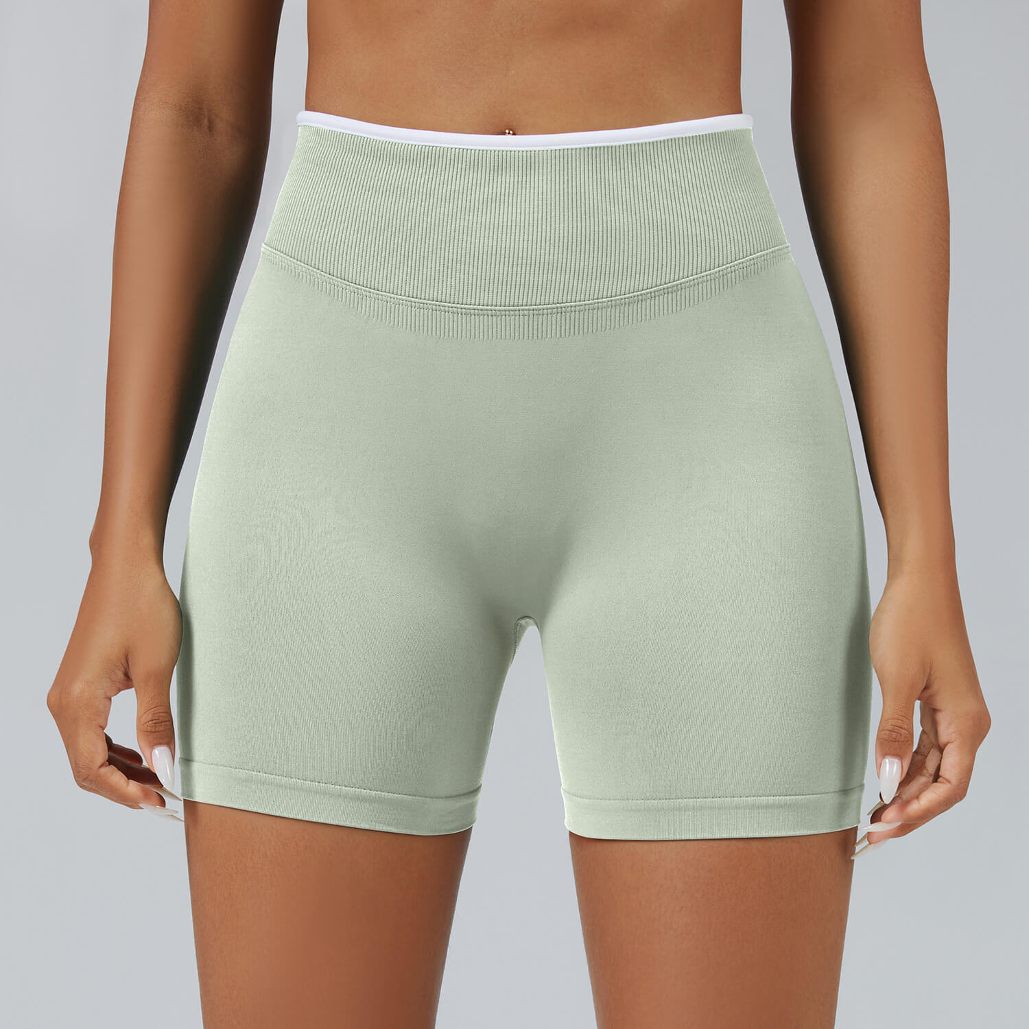 Personalized seamless athletic shorts with custom branding in pistachio green