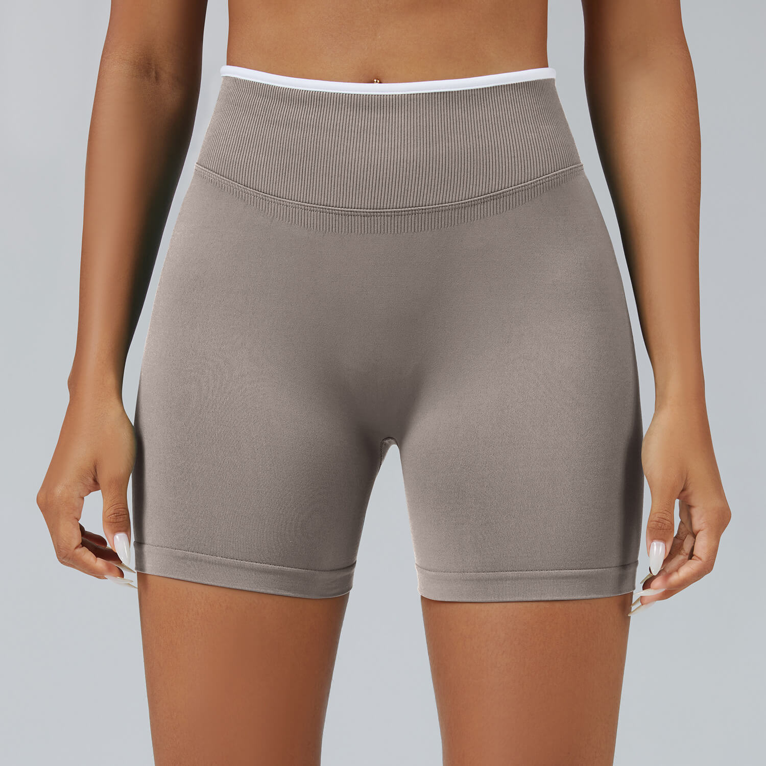 Personalized seamless athletic shorts with custom branding in stone color