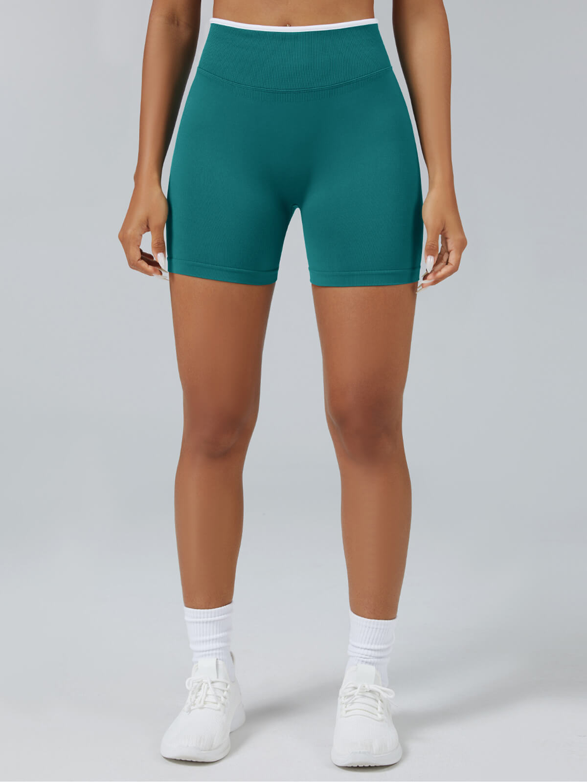Personalized seamless athletic shorts with custom branding in teal