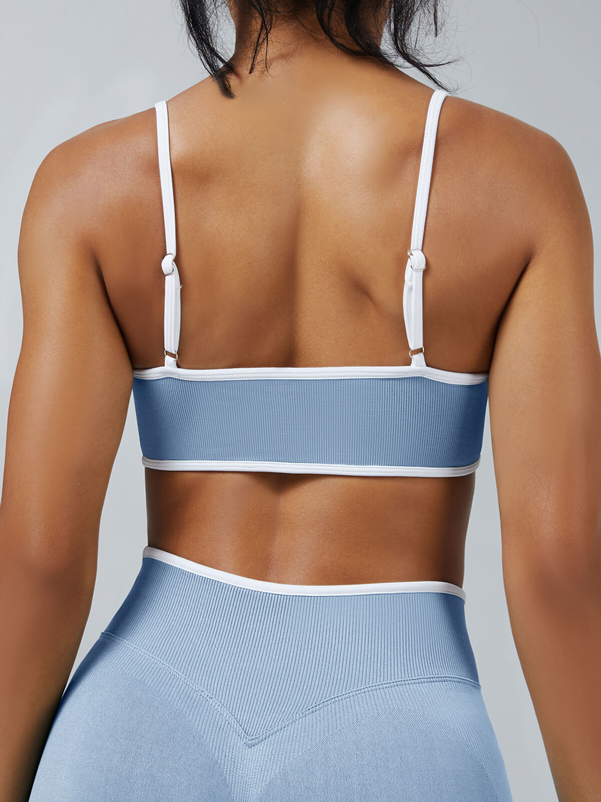 Baby blue seamless sports bra back view with adjustable straps