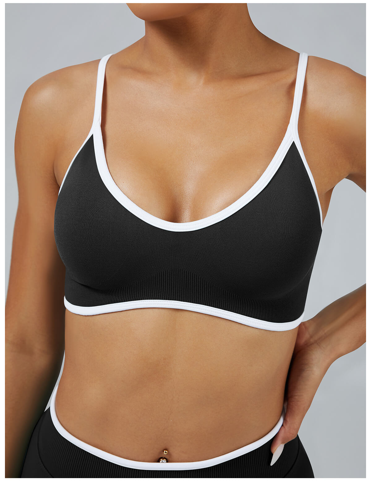 Black seamless sports bra with white contrast trim